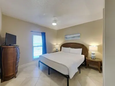 a bedroom with a bed and a television in it at Majestic Beach Towers I #1311 in Panama City Beach