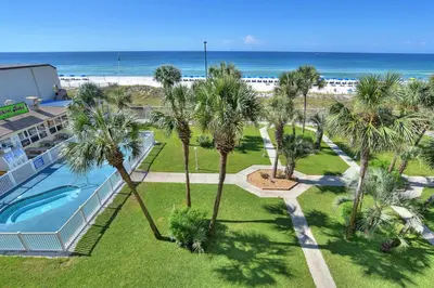 an aerial view of a resort with a swimming pool and the beach at Summit Beach Resort 430 in Panama City Beach