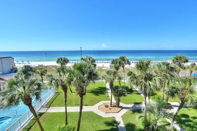 an aerial view of the beach and palm trees at Summit Beach Resort 430 in Panama City Beach