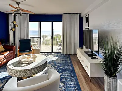 a living room with a couch and a table at Summit Beach Resort 430 in Panama City Beach