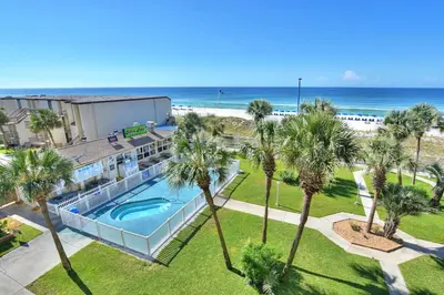 an aerial view of a resort with a swimming pool and the beach at Summit Beach Resort 430 in Panama City Beach