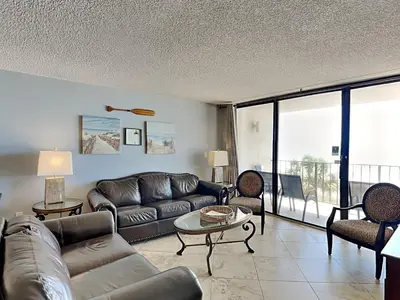 a living room with a couch and a table at Edgewater Tower III #212 in Panama City Beach