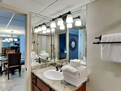 a bathroom with a sink and a mirror at Edgewater Tower III #212 in Panama City Beach