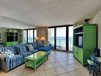 a living room with a couch and a television at Edgewater Tower II 909 in Panama City Beach