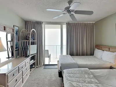a bedroom with two beds and a ceiling fan at Long Beach Resort Tower III #602 in Panama City Beach