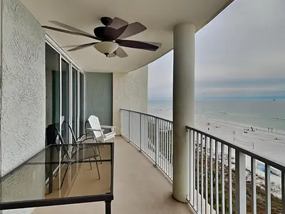 a balcony with a ceiling fan and a view of the beach at Long Beach Resort Tower III #602 in Panama City Beach