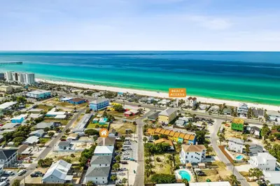 an aerial view of a city and the beach at Little Palm Unit A in Panama City Beach