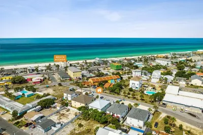 an aerial view of a city and the beach at Little Palm Unit A in Panama City Beach