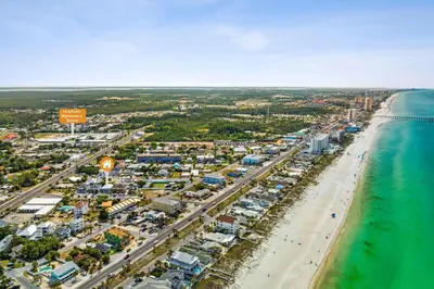 an aerial view of a beach and the ocean at Little Palm Unit A in Panama City Beach