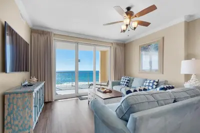 a living room with a couch and a ceiling fan at Ocean Villa 803 in Panama City Beach