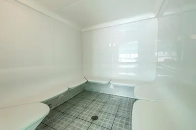 a white room with a toilet and a tiled floor at Ocean Villa 803 in Panama City Beach