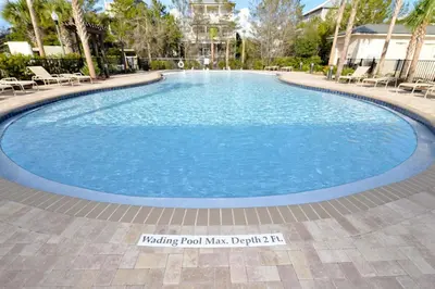 a large swimming pool with blue water at Village of South Walton E303 in Rosemary Beach