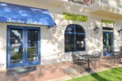 a restaurant with tables and chairs outside of a building at Village of South Walton E303 in Rosemary Beach