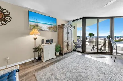 a living room with a view of the ocean at Sunbird 211E in Panama City Beach
