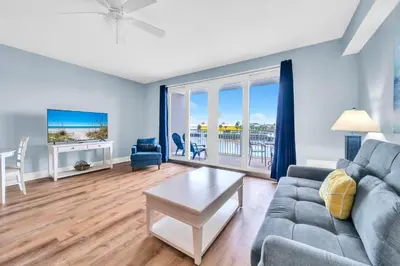 a living room with a couch and a table at Laketown Wharf 116 in Panama City Beach