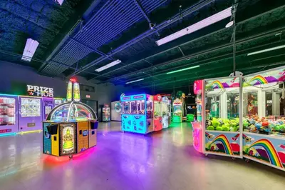a row of arcade games in a room at Laketown Wharf 116 in Panama City Beach