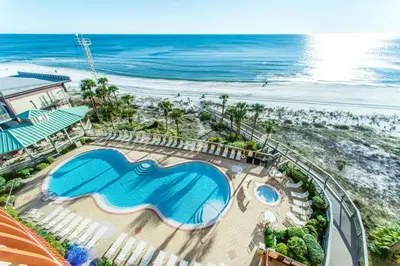 an aerial view of a resort with a swimming pool and the beach at Hidden Dunes 901 in Panama City Beach