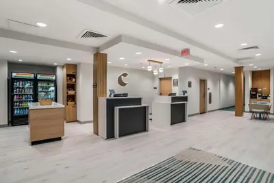 a lobby of a store with counters and tables at Comfort Inn & Suites Panama City Beach - Pier Park Area in Panama City Beach