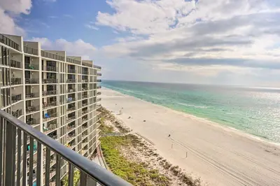 a view of the beach from the balcony of a resort at Idyllic PCB Condo with Pool Access and Ocean Views! in Panama City Beach