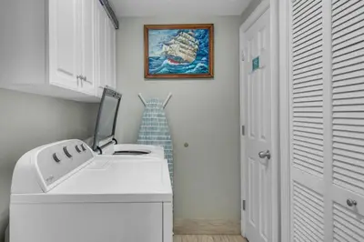 a white bathroom with a sink and a shower at Majestic Beach Towers 2-1305 in Panama City Beach