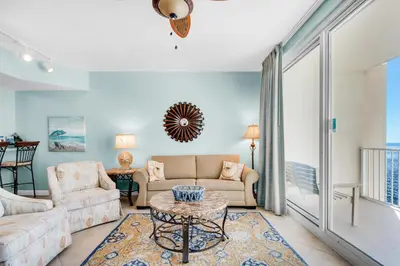 a living room with a couch and a table at Shores of Panama 1617 in Panama City Beach