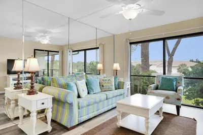a living room with a couch and two chairs at Edgewater Golf Villa 2010 in Panama City Beach