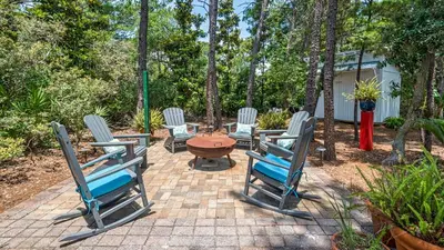 a group of chairs sitting on a brick patio at 171 Seacrest in Seacrest