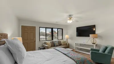 a bedroom with a bed and a flat screen tv at Hidden Beach 219 in Santa Rosa Beach