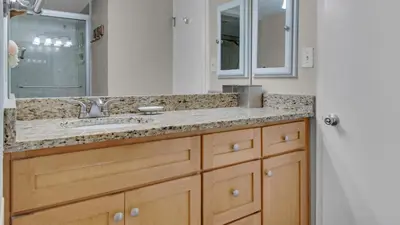 a bathroom with a sink and a mirror at Beachcrest 1204 in Santa Rosa Beach