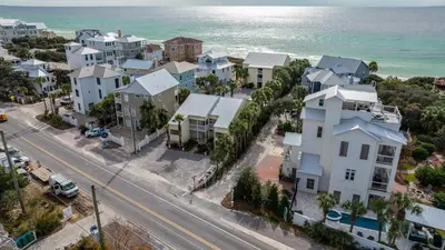 an aerial view of a city with houses and the ocean at Beacons 1 in Santa Rosa Beach