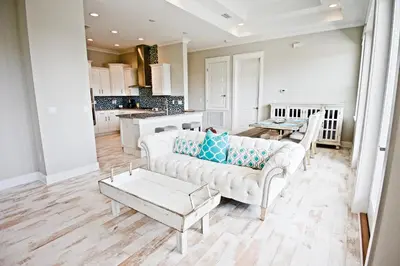 a living room with a couch and a table at Beach Abode in Watersound Beach