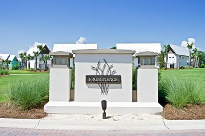 a white house with a foreclosure sign on it at Beach Abode in Watersound Beach
