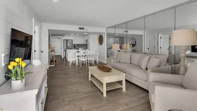 a living room with a couch and a table at Beachcrest 204 in Santa Rosa Beach