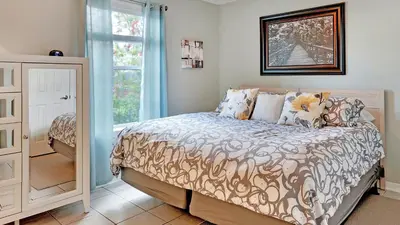 a bedroom with a bed and a window at Beachside Villas 411 in Santa Rosa Beach