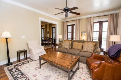 a living room with a couch and a coffee table at Southern Grounds in Santa Rosa Beach