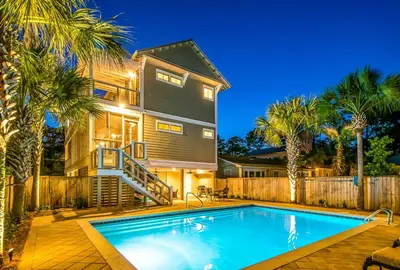 a house with a swimming pool in front of a house at Southern Grounds in Santa Rosa Beach