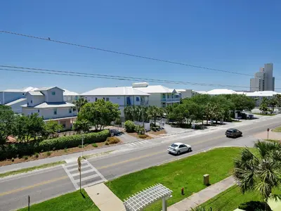 a view of a street with cars driving down a road at Grand Isle 304 in Santa Rosa Beach