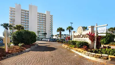 a street in front of a hotel with a building at Beachcrest 404 in Santa Rosa Beach