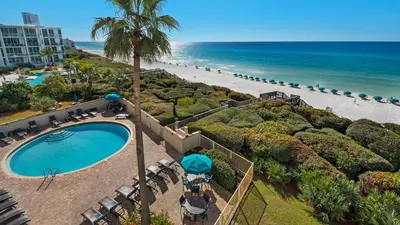 an aerial view of a resort with a swimming pool and the beach at Beachcrest 404 in Santa Rosa Beach