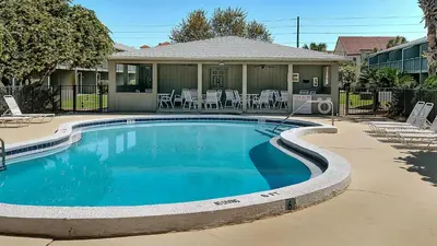 a swimming pool in front of a house at Hidden Beach 117 in Santa Rosa Beach