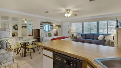 a room with a kitchen and a living room at Hidden Beach 240 in Santa Rosa Beach