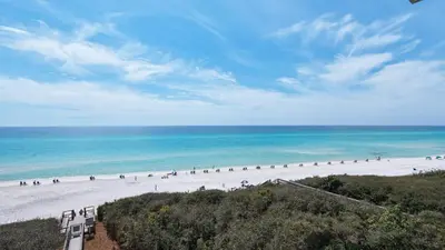 a group of people on a beach near the ocean at Legacy 403 in Santa Rosa Beach