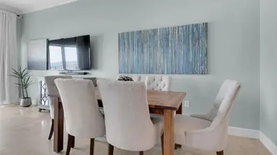 a dining room with a wooden table and chairs at Legacy 403 in Santa Rosa Beach