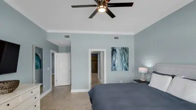 a bedroom with a bed and a ceiling fan at Legacy 403 in Santa Rosa Beach