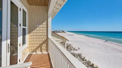 a balcony of a house with a view of the beach at Leeward I Unit 8 in Santa Rosa Beach