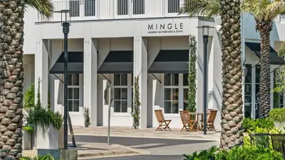 a lobby of a hotel with palm trees at Mistral 1 Bare Feet Retreat in Seacrest