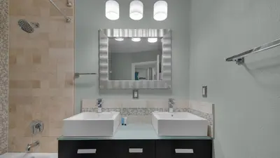 a bathroom with two sinks and a mirror at Mistral 1 Bare Feet Retreat in Seacrest