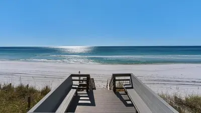 a boardwalk to the beach with the ocean in the background at Emerald Hill 12A in Santa Rosa Beach