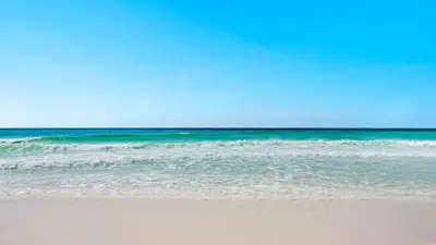 a sandy beach with the ocean in the background at Mon Petit Chateau in Panama City Beach
