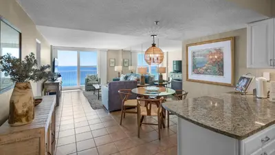 a living room with a kitchen and a dining room at Beachcrest 1201 in Santa Rosa Beach